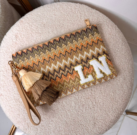 orange zig zag personalised woven tassel clutch bag