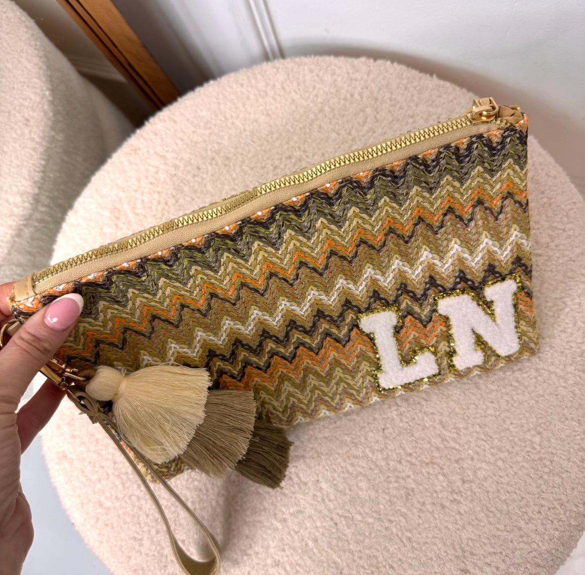 orange zig zag personalised woven tassel clutch bag