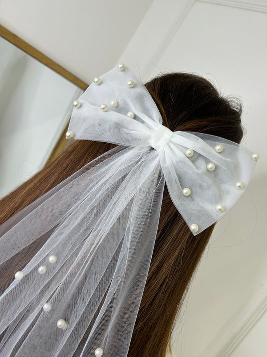 White bridal pearl hair bow with veil