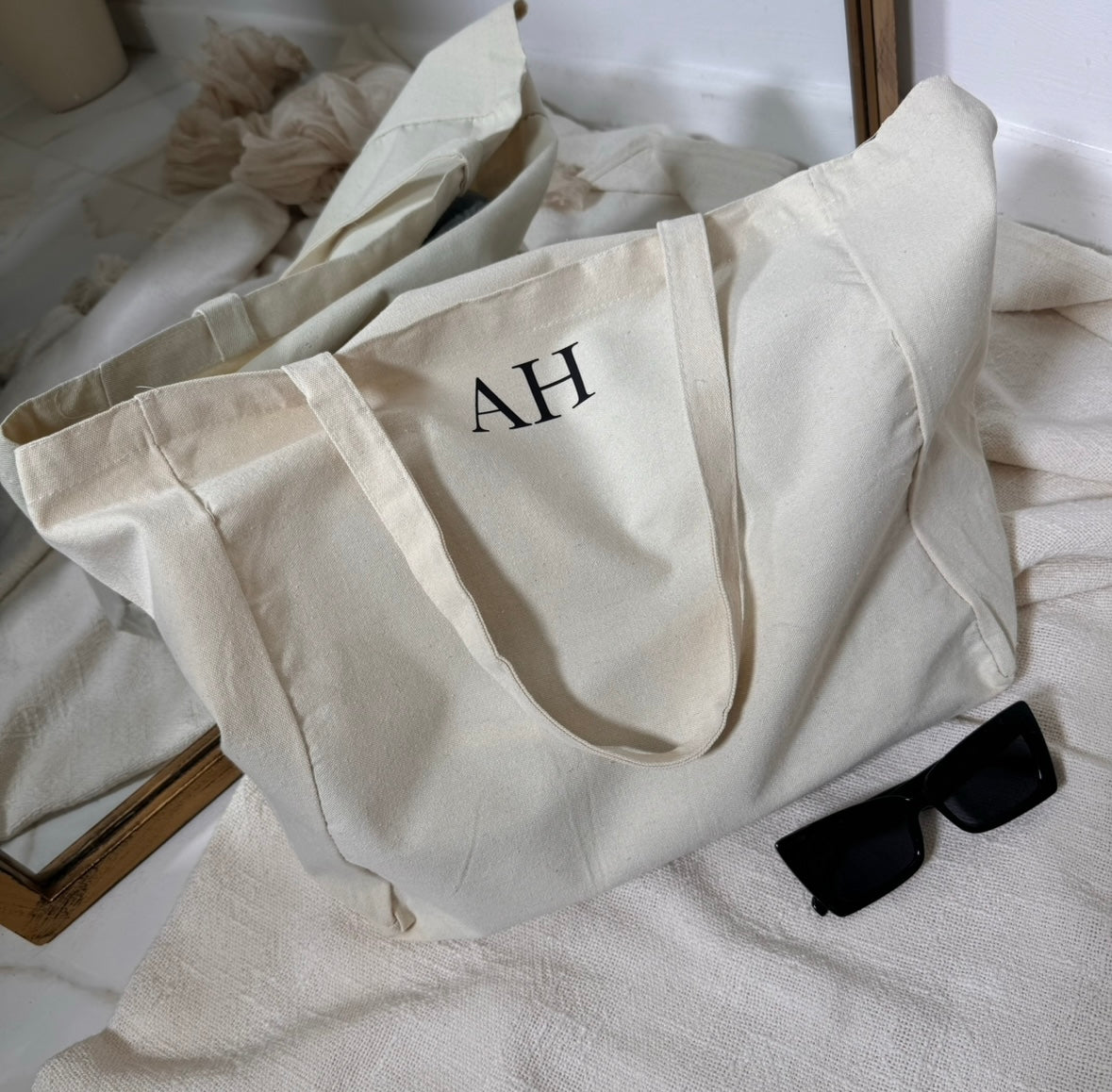 cream canvas tote bag with black initials