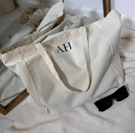 cream canvas tote bag with black initials