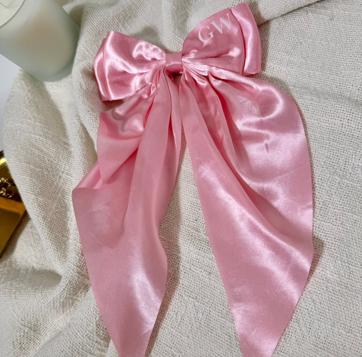 pink long satin bow with white initials