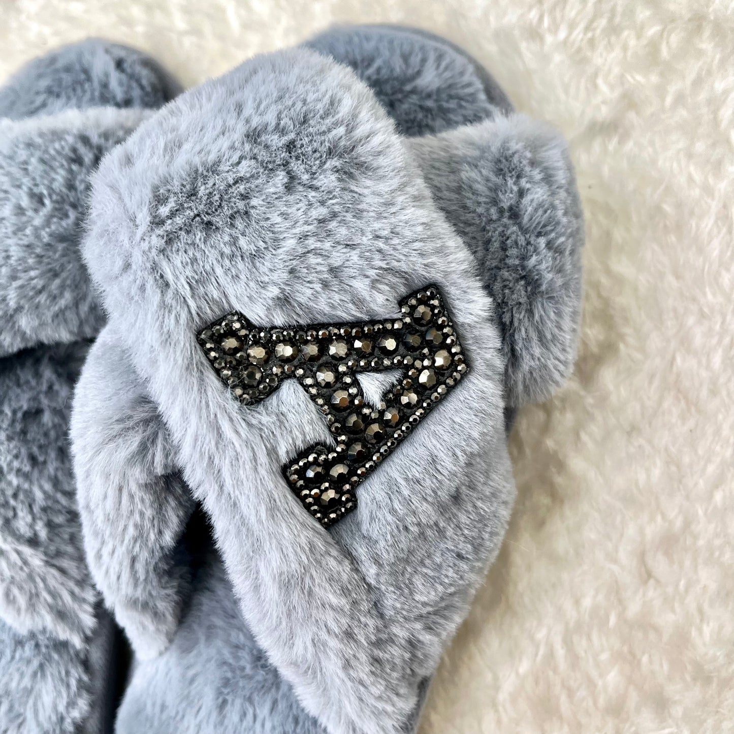 SINGLE INITIAL grey fluffy slippers with black diamante